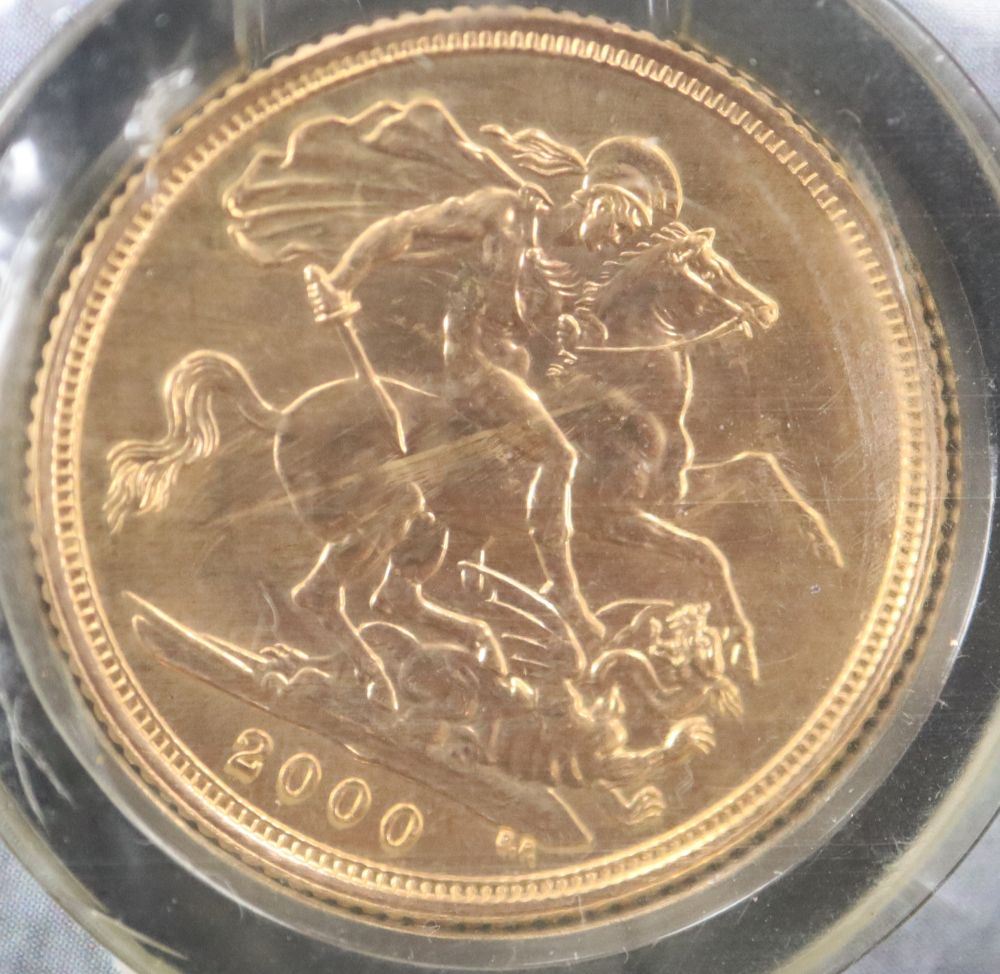 A 2000 gold sovereign, in Royal Mint packet.